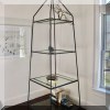 F10. Large etagere with glass shelves. 106”h x 32”w x 32”d 